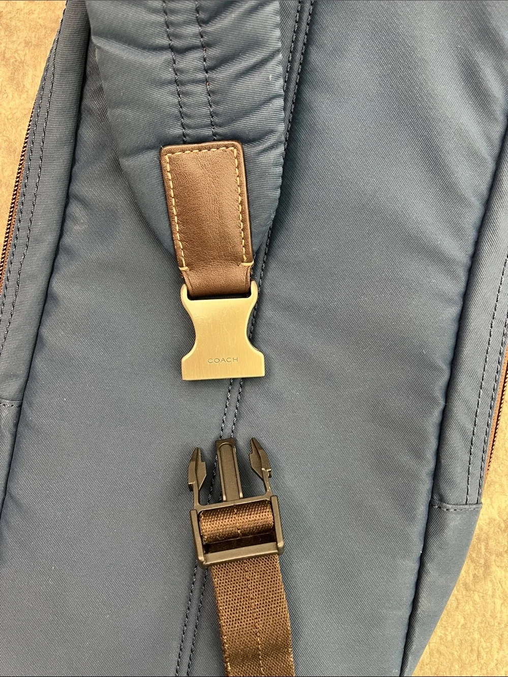 COACH Varick sling bag in navy blue / gray nylon with brown leather trim